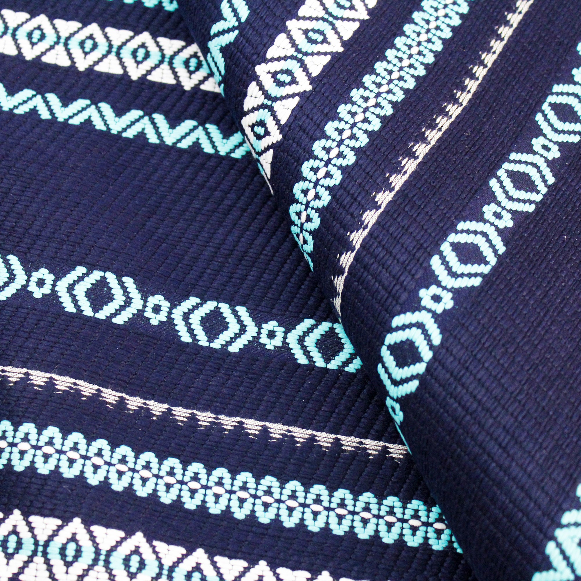 Tissu jacquard en coton motifs graphiques turquoise et blanc