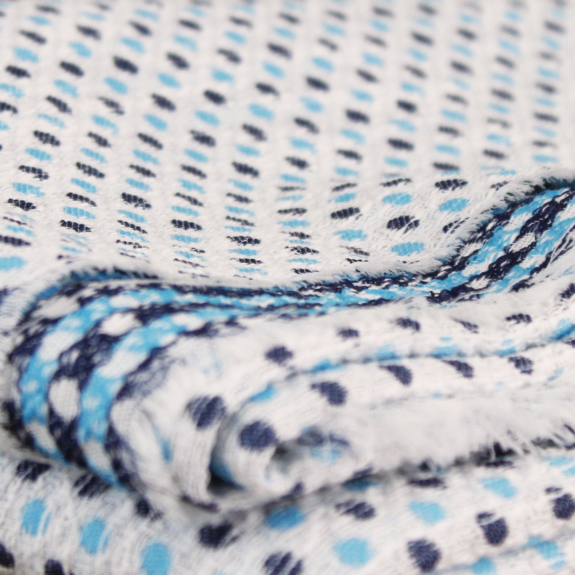 Cotton jacquard fabric with sky blue and navy polka dots