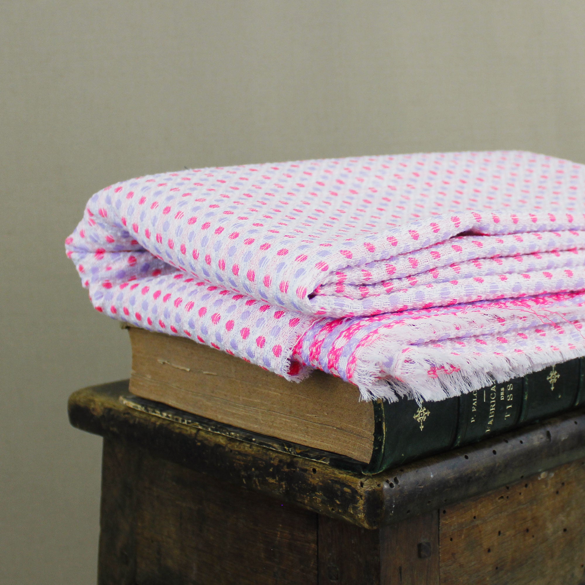 Cotton jacquard fabric with pink and parma polka dots