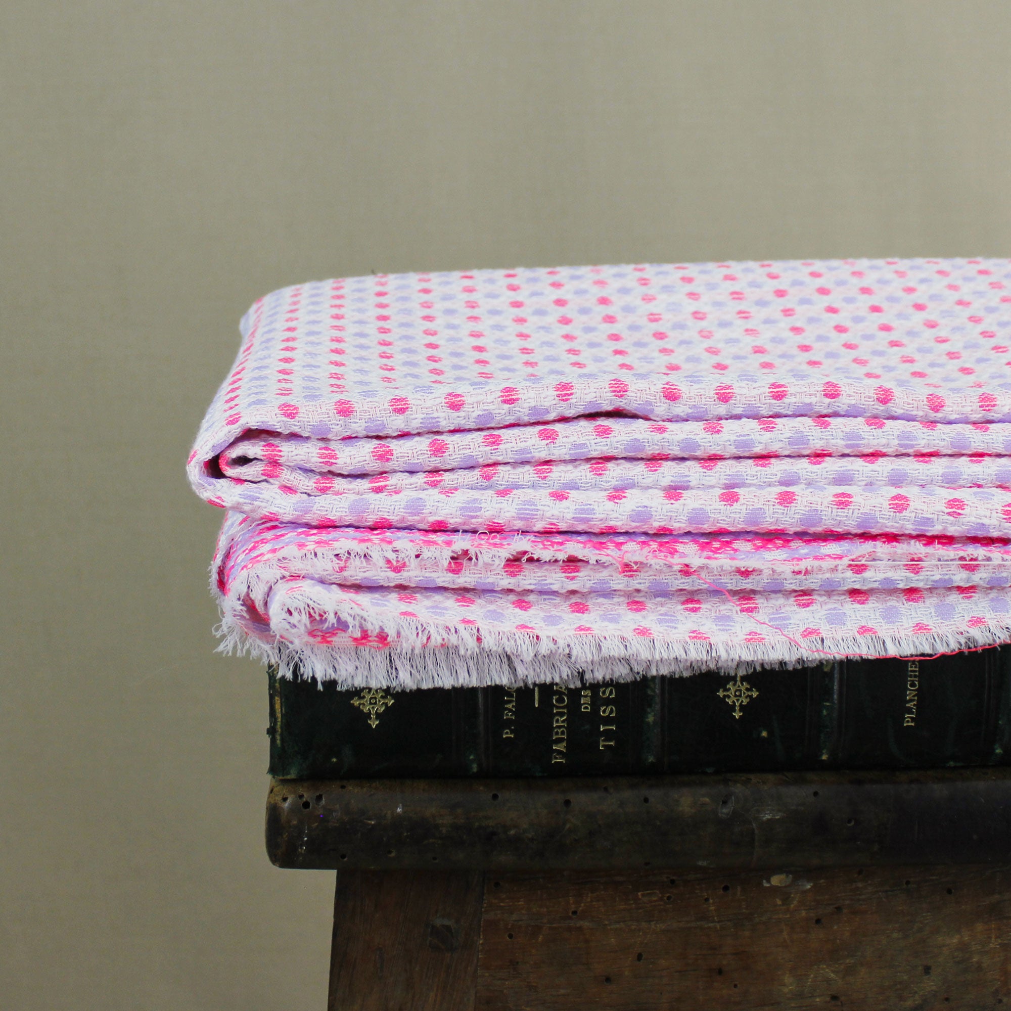 Cotton jacquard fabric with pink and parma polka dots