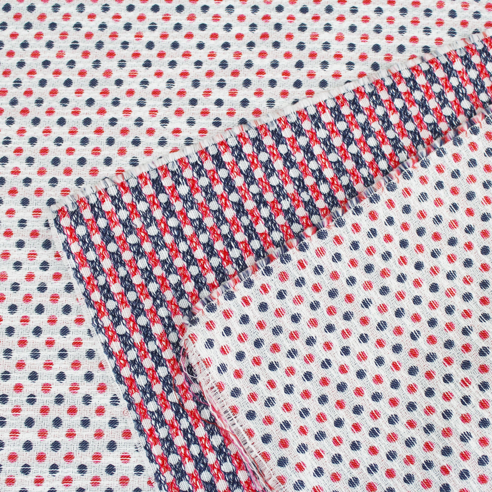 Cotton jacquard fabric with red and blue dots